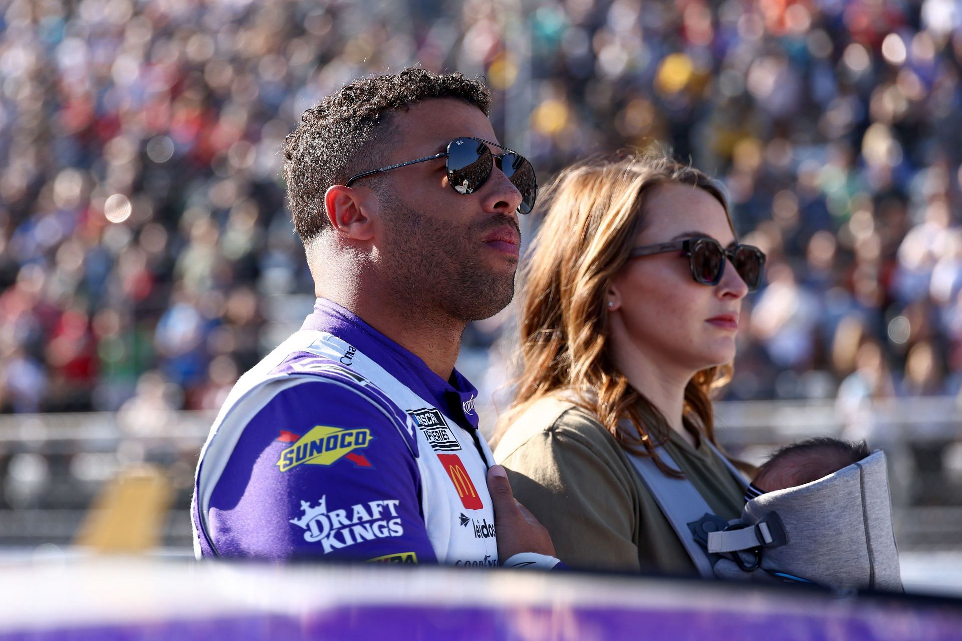 MARTINSVILLE, VIRGINIA - NOVEMBER 03: Bubba Wallace, driver of the #23 Xfinity Toyota, and wife, Amanda Wallace stand on the grid during pre-race ceremonies prior to the NASCAR Cup Series Xfinity 500 at Martinsville Speedway on November 03, 2024 in Martinsville, Virginia. (Photo by David Jensen/Getty Images) - Source: Getty