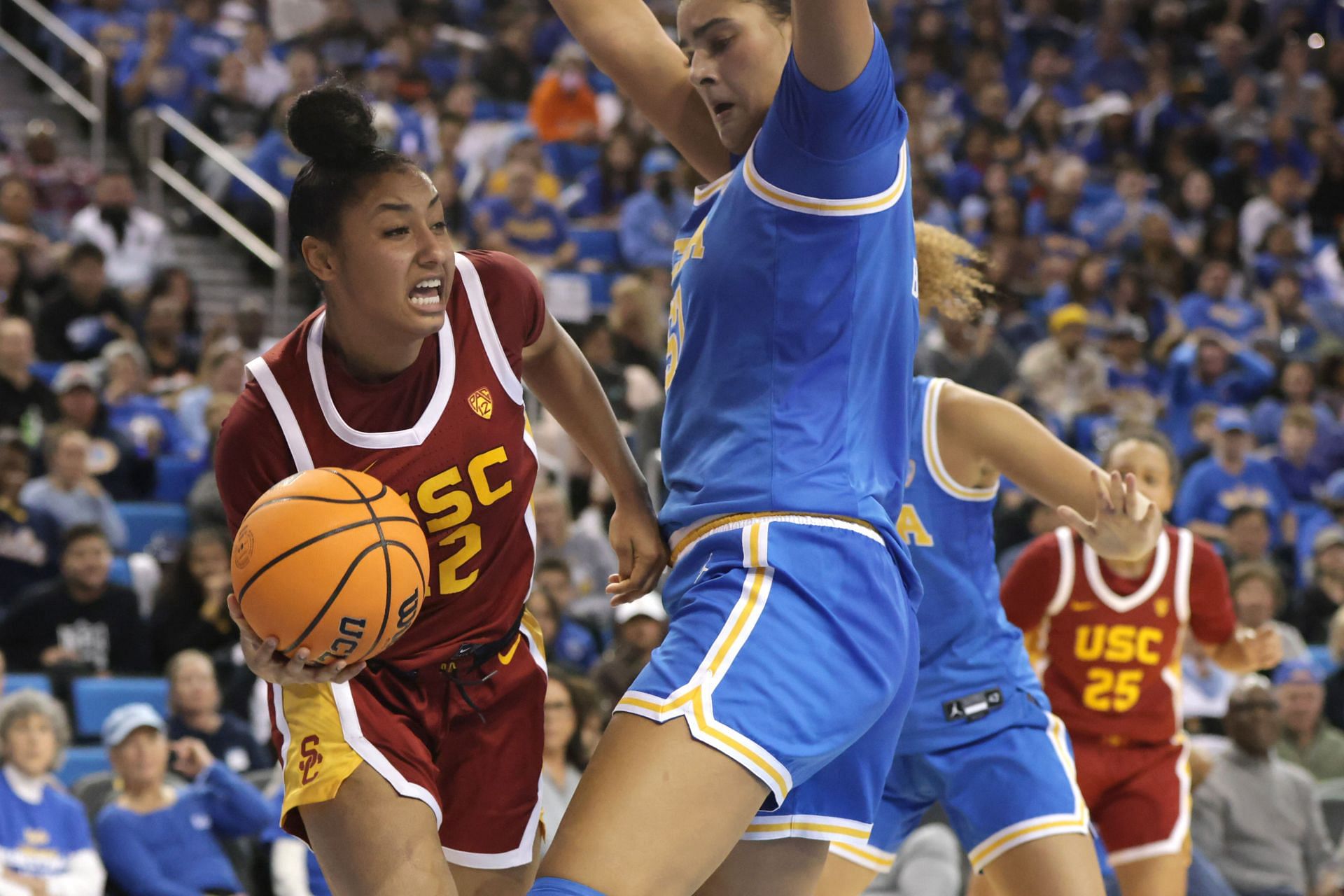 JuJu Watkins (#12) of the USC Trojans drives around Lauren Betts (#51) of the UCLA Bruins during the second half of their game at Pauley Pavilion on December 30, 2023 in Los Angeles. Photo: Getty