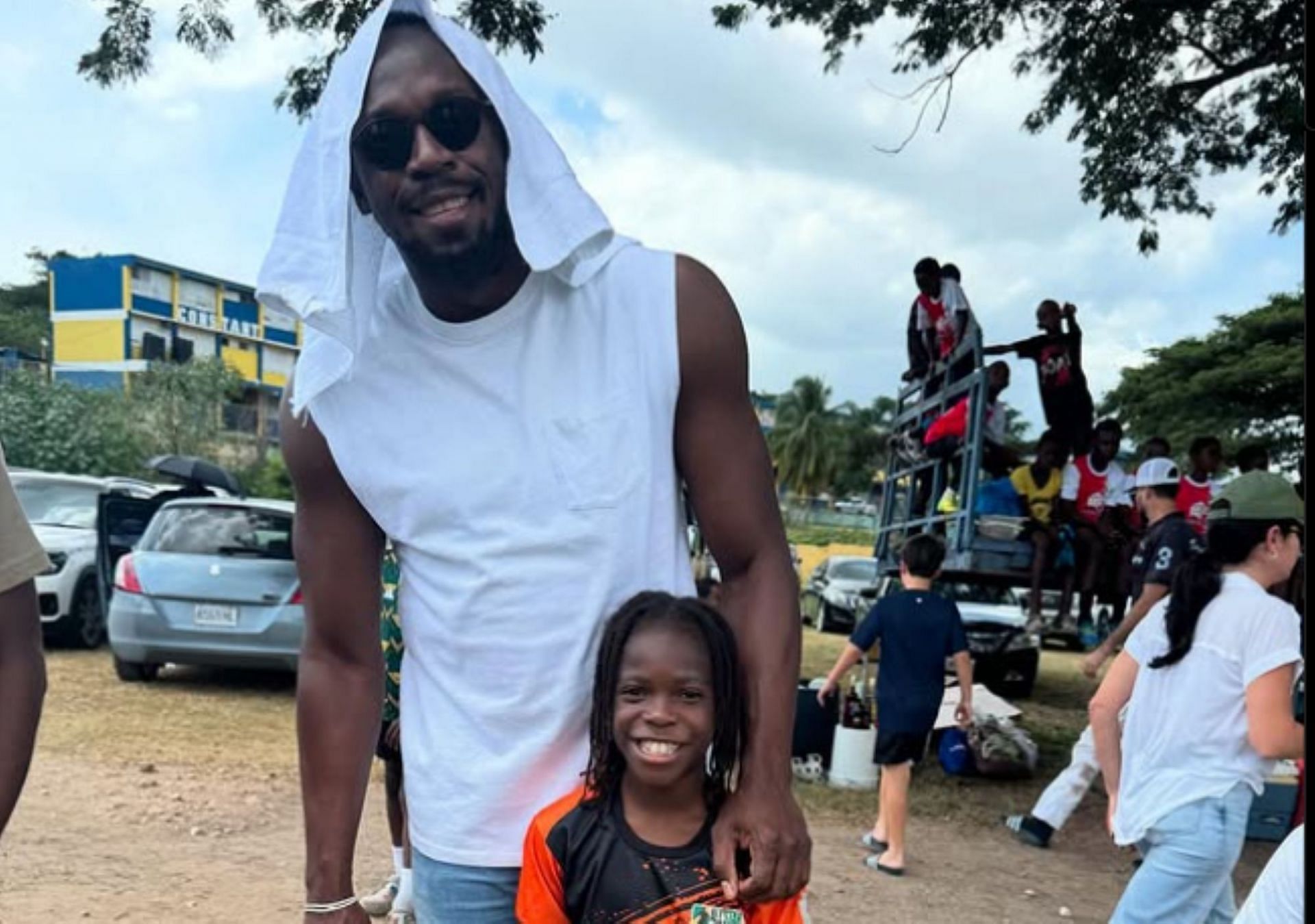 Usain Bolt shares a frame with godson NJJ