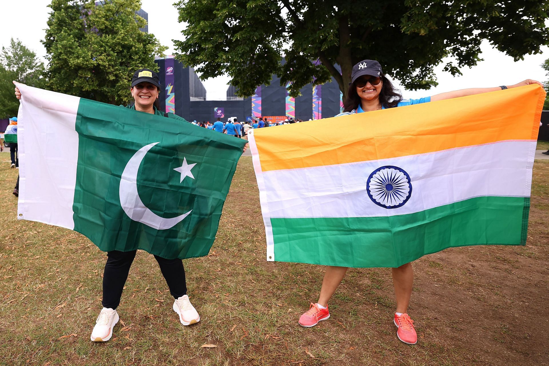 Two fans hold up the flags of Pakistan and India outside the stadium before the ICC Men&#039;s T20 Cricket World Cup West Indies &amp; USA 2024 match at Nassau County International Cricket Stadium (Photo by Robert Cianflone/Getty Images)