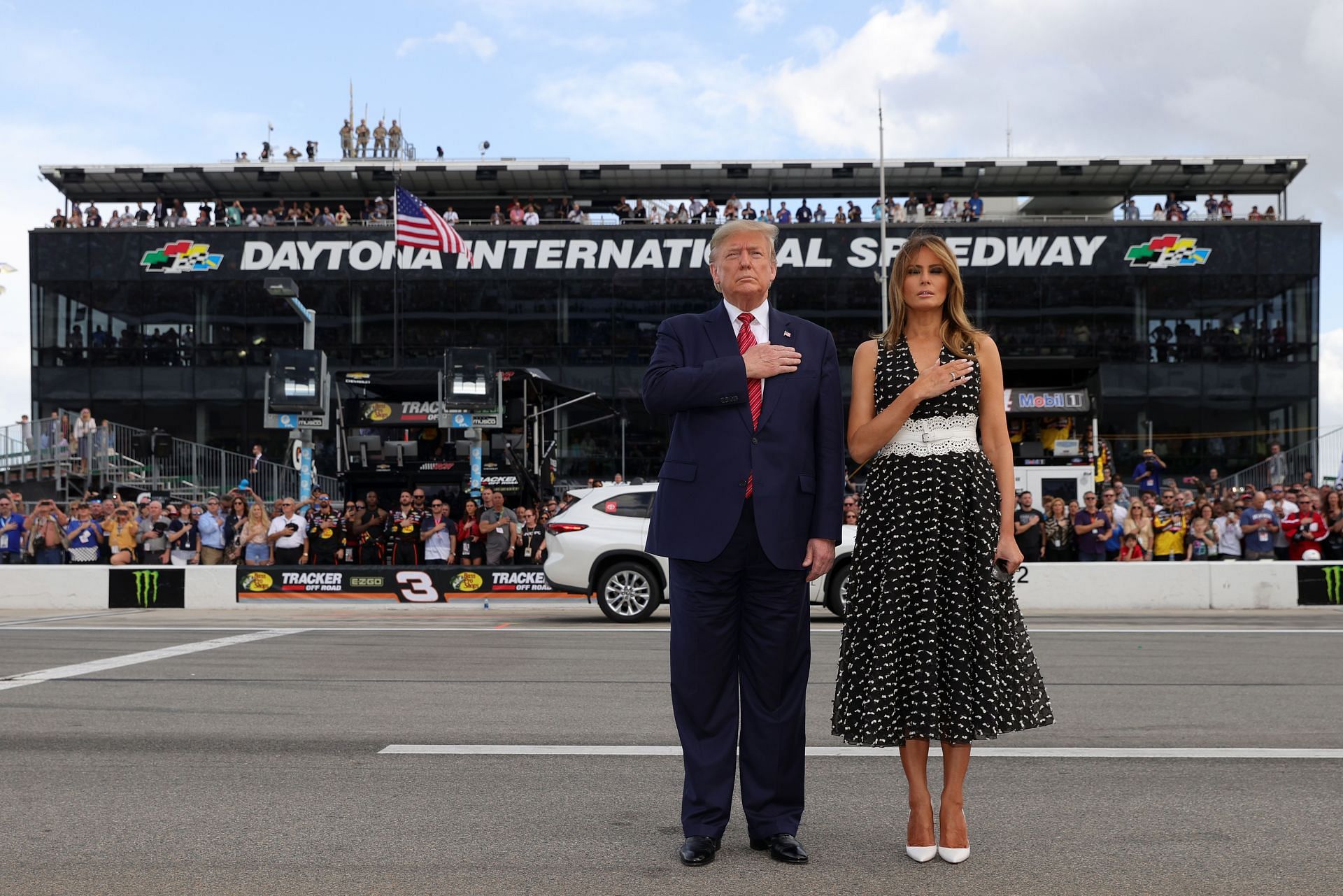 U.S. President Donald Trump and First Lady Melania Trump stand for the national anthem prior to the NASCAR Cup Series 62nd Annual Daytona 500 - Source: Getty