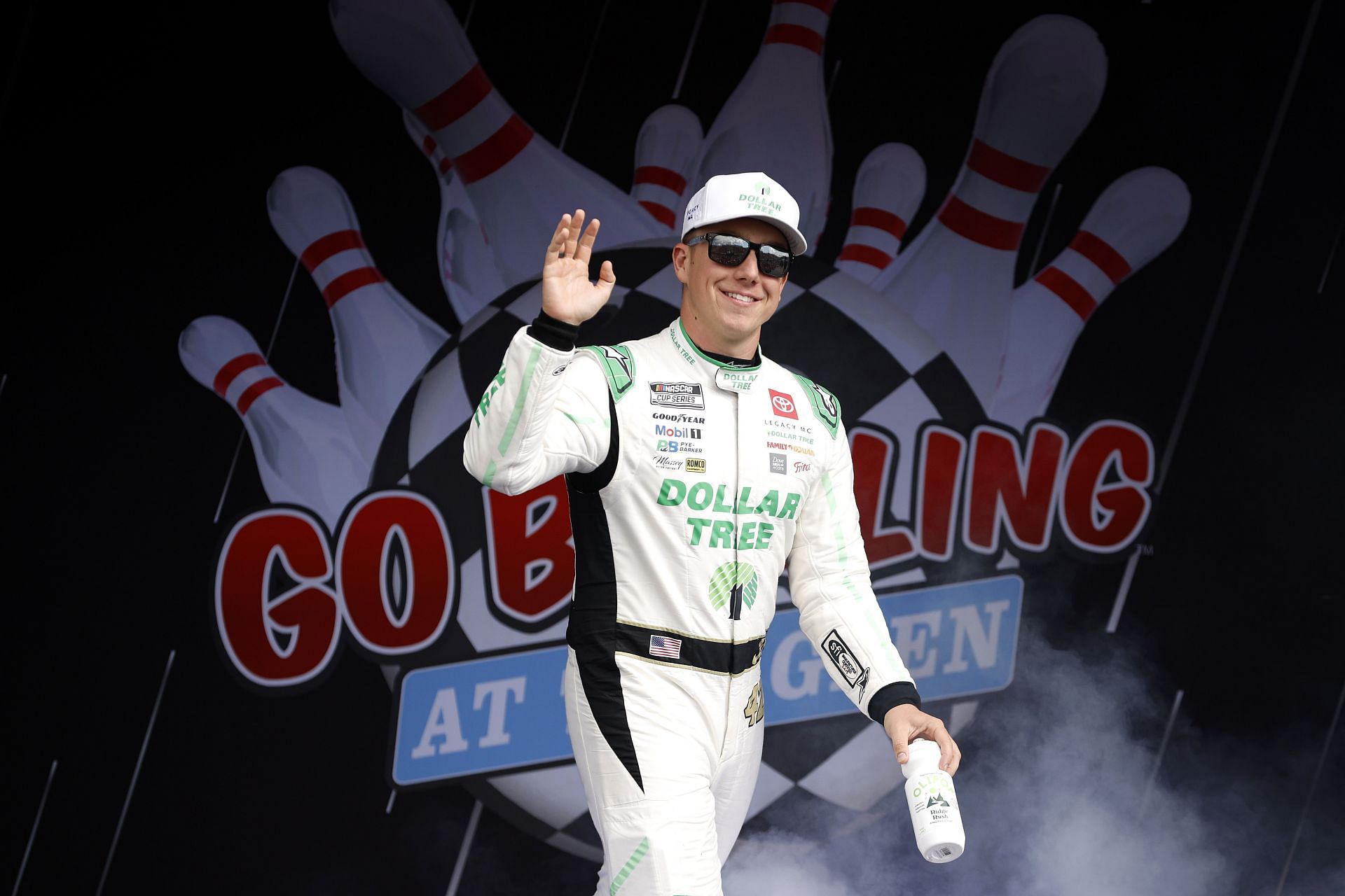 WATKINS GLEN, NEW YORK - SEPTEMBER 15: John H. Nemechek, driver of the #42 Dollar Tree Toyota, waves to fans as he walks onstage during driver intros prior to the NASCAR Cup Series Go Bowling at The Glen at Watkins Glen International on September 15, 2024 in Watkins Glen, New York. (Photo by Sean Gardner/Getty Images) - Source: Getty