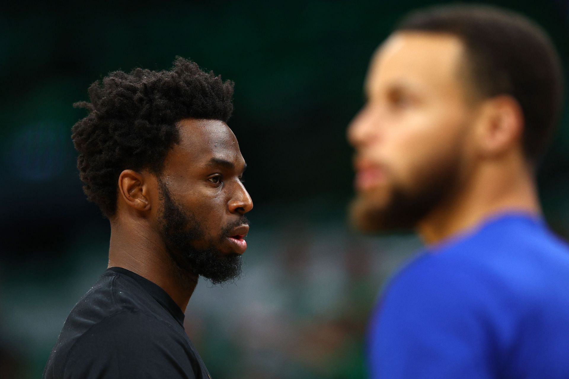 Andrew Wiggins #22 and Stephen Curry #30 of the Golden State Warriors warm up before an NBA game. (Credits: Getty)