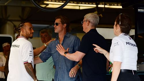 Lewis Hamilton of Great Britain and Mercedes meets Brad Pitt and Tim Cook in the garage prior to the F1 Grand Prix of USA at Circuit of The Americas on October 23, 2022 - Source: Getty