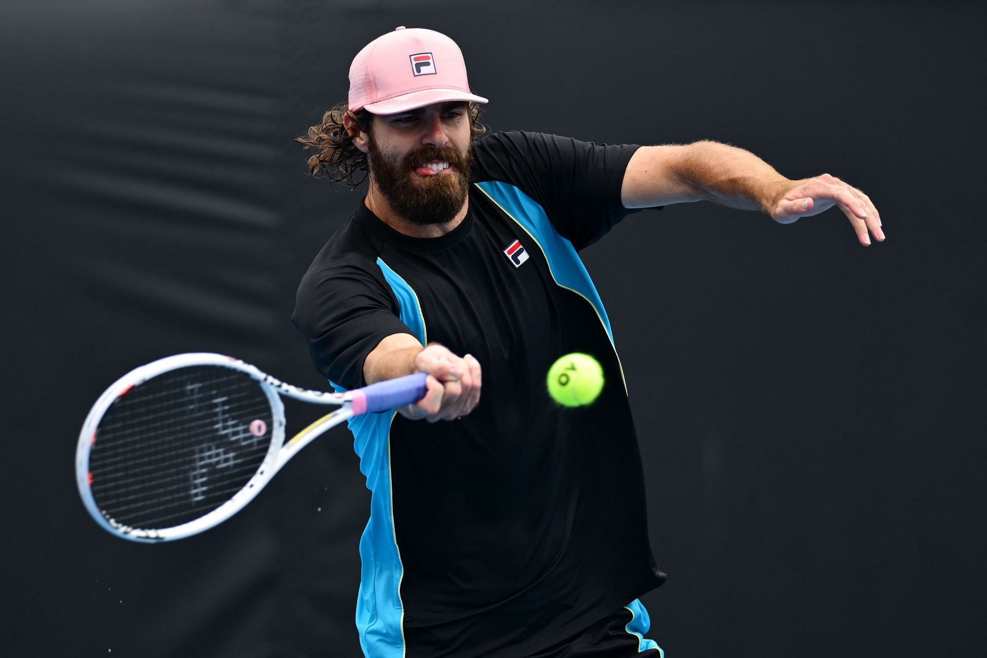 Reilly Opelka hits a forehand in Brisbane | Image Source: Getty