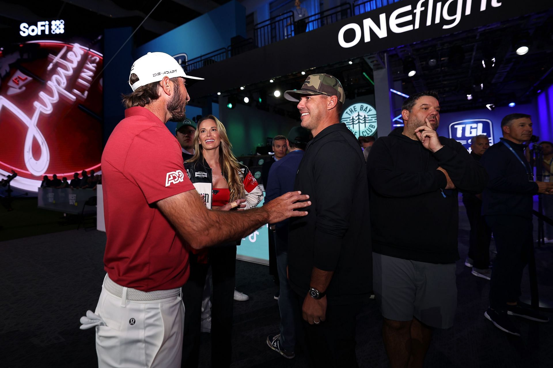 Max Homa of Jupiter Links Golf Club talks with Brooks Koepka and Jenna Sims before the TGL match between his side and The Bay Golf Club - Source: Getty