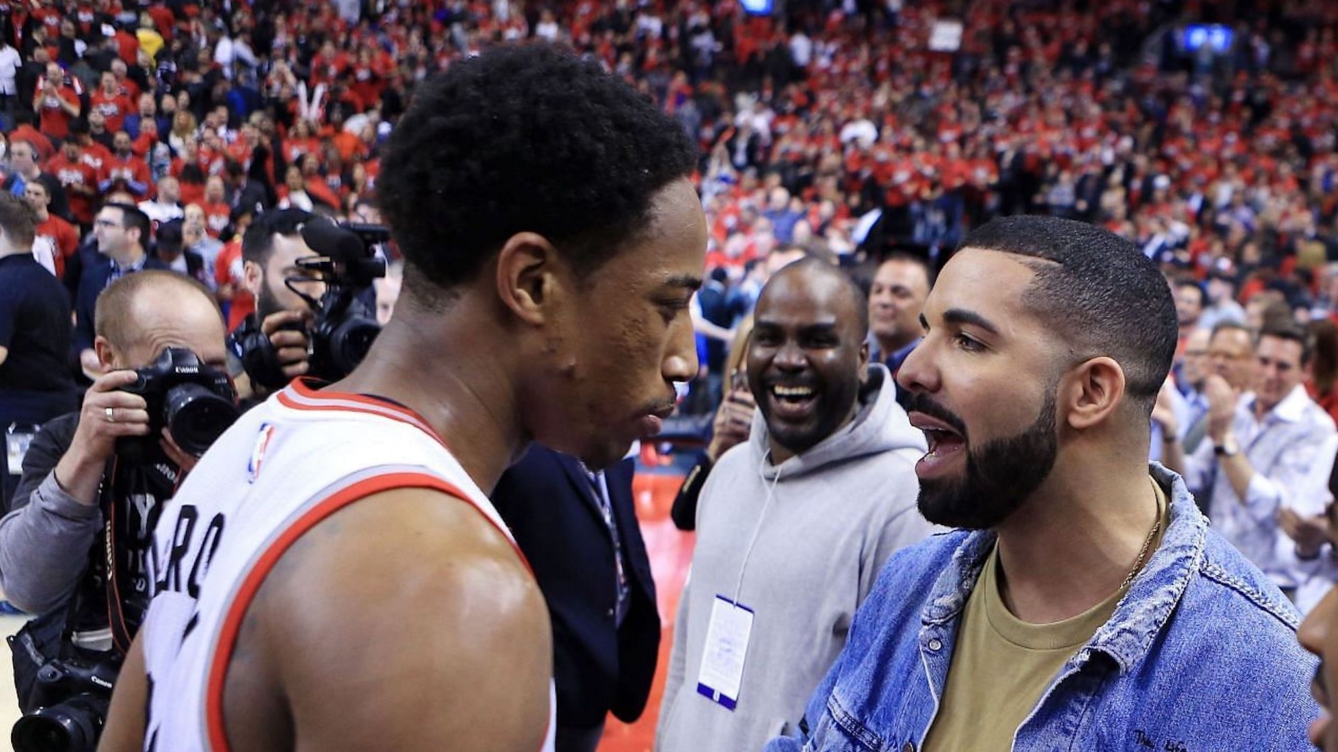 Drake and DeMar DeRozan during the 2016 NBA Playoffs at the Air Canada Centre on May 01, 2016, in Toronto, Ontario, Canada. (Image via Getty/Vaughn Ridley)