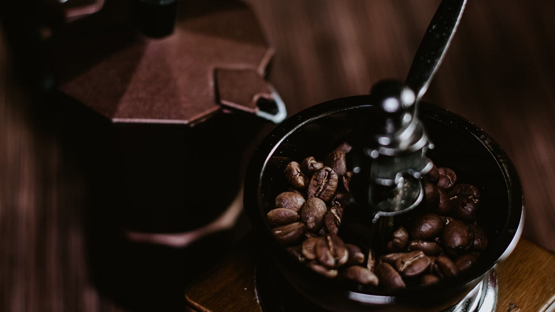 Using whole beans and grinding them fresh ensures the freshest cup every time (Image via Unsplash)