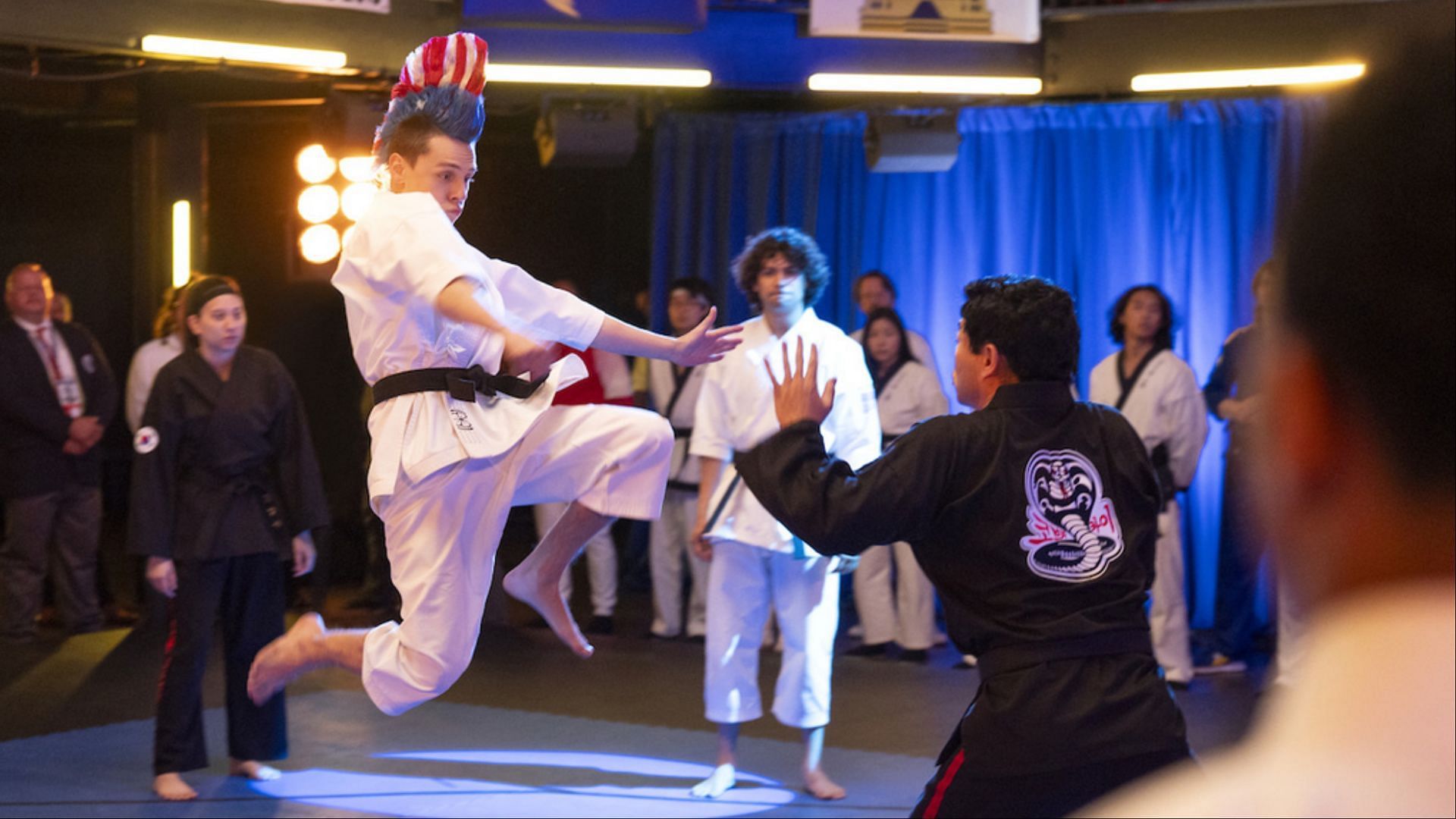 Hawk showcasing his signature high-flying kick during a critical match at the Sekai Taikai. (Image via Netflix Tudum)