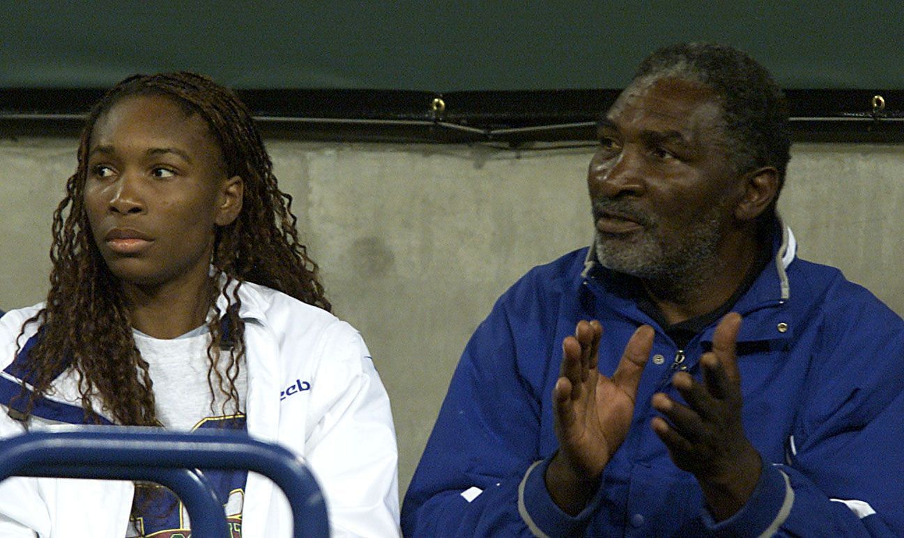 Venus Williams and her father Richard watch Serena Williams at Indian Wells 2001 (Source: Getty)