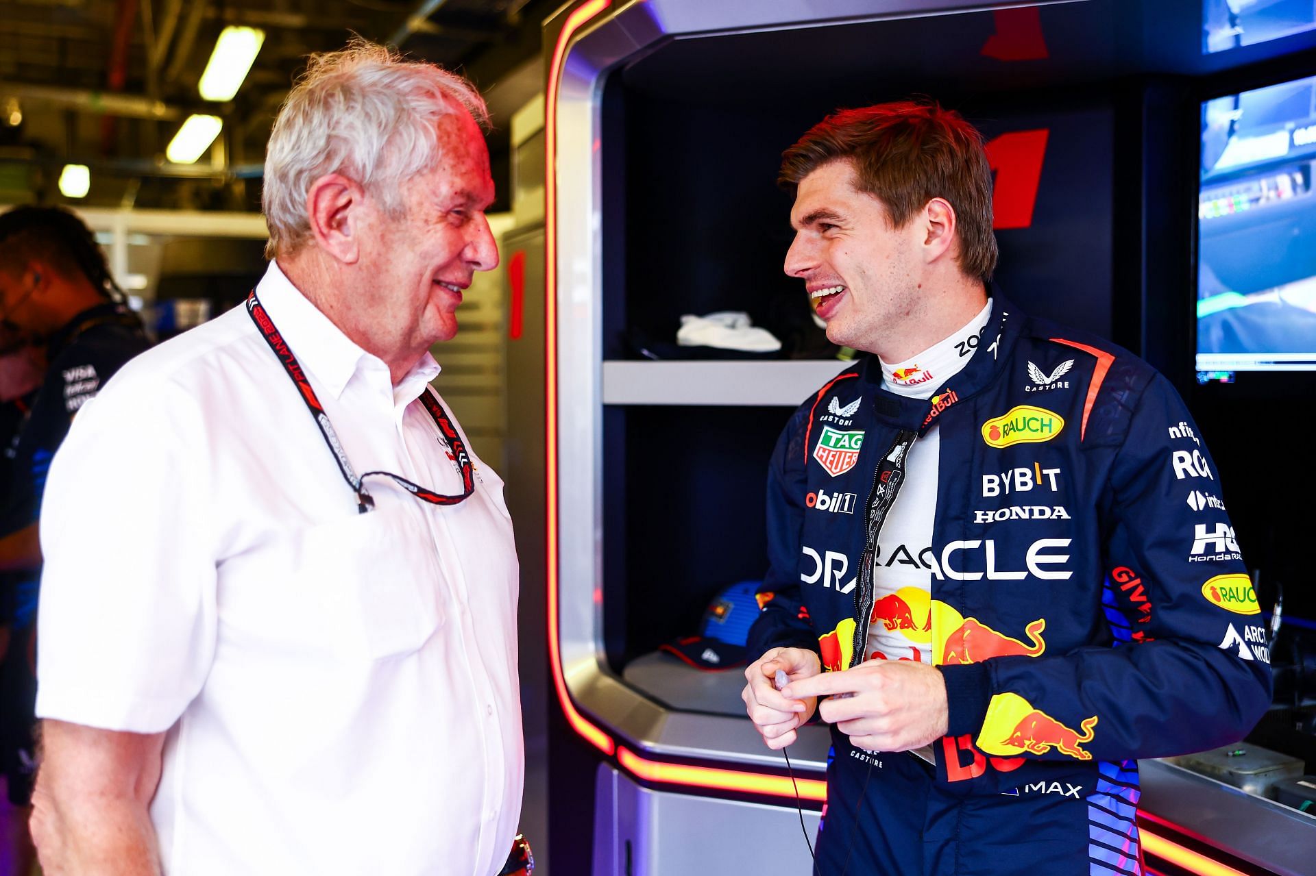 Max Verstappen of the Netherlands and Oracle Red Bull Racing talks with Oracle Red Bull Racing Team Consultant Dr Helmut Marko in the garage - Source: Getty