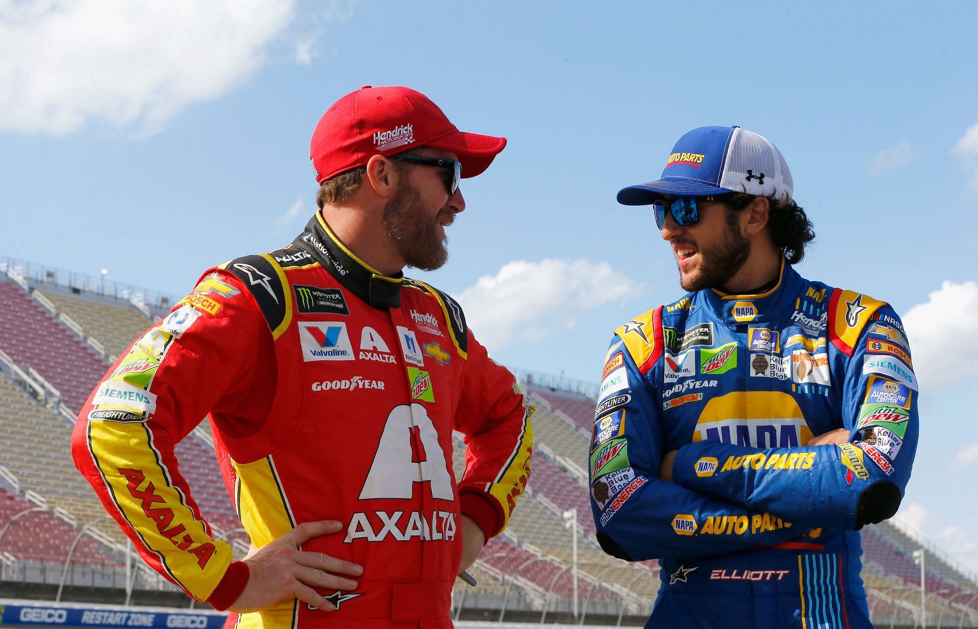 BROOKLYN, MI - AUGUST 11: Dale Earnhardt Jr., driver of the #88 Axalta Chevrolet, talks to Chase Elliott, driver of the #24 NAPA Chevrolet, on the grid during qualifying for the Monster Energy NASCAR Cup Series Pure Michigan 400 at Michigan International Speedway on August 11, 2017 in Brooklyn, Michigan.  (Photo by Jonathan Ferrey/Getty Images) - Source: Getty