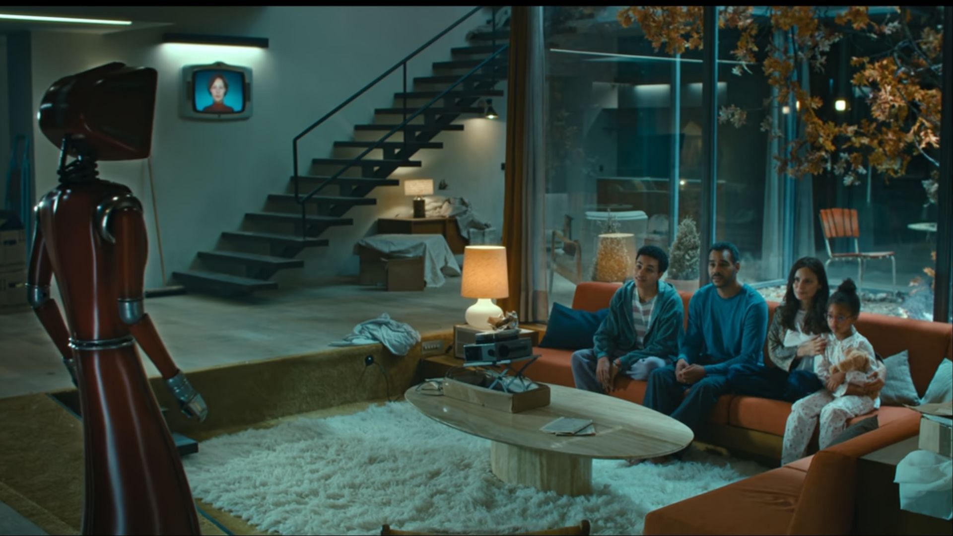 The family interacting with the AI robot for the first time in the series (Image via Netflix)