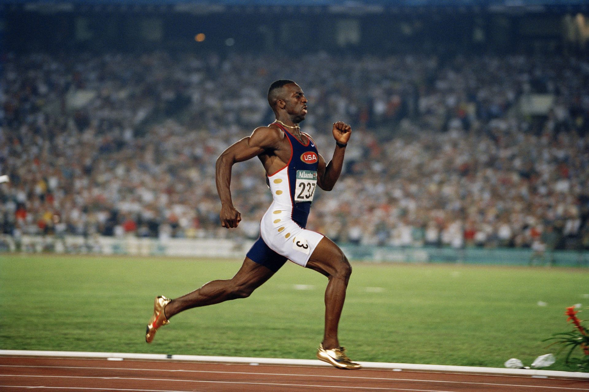 Michael Johnson running at a track event - (Source: Getty)