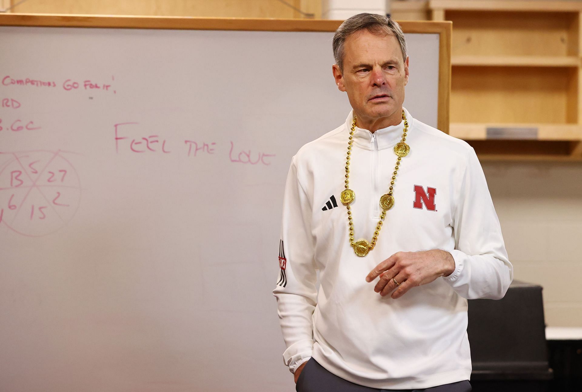 Cook addressing her Nebraska Cornhuskers side at the 2023 NCAA Championships (Image via: Getty Images)