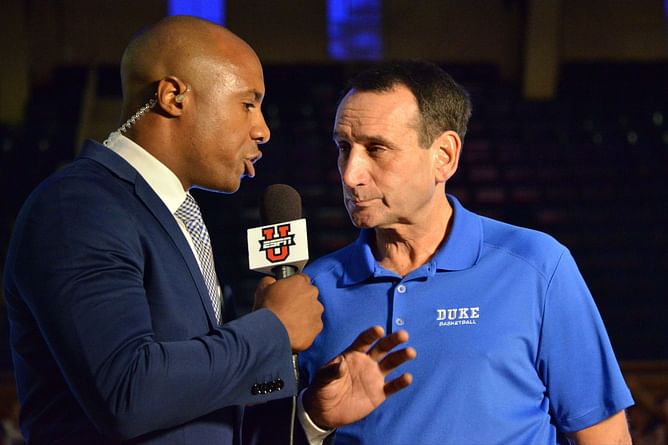 Former Blue Devil Jay Williams shares a moment with Coach K on the sidelines of Duke vs UNC