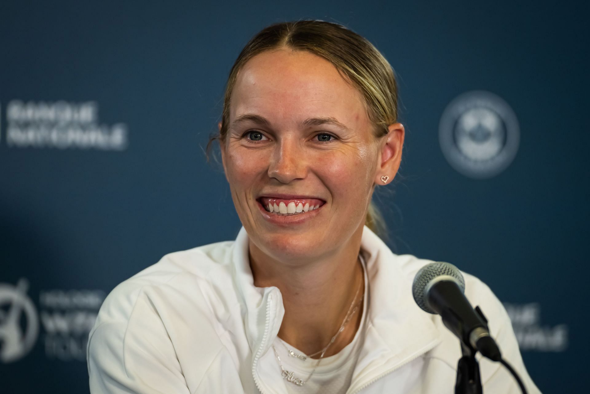 Caroline Wozniacki pictured speaking to the press [Image Source: Getty Images]