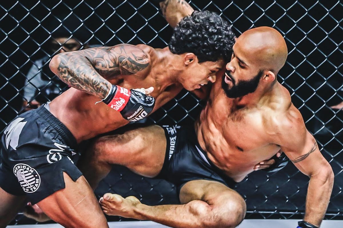 Adriano Moraes fighting Demetrious Johnson. [Photo via: ONE Championship]