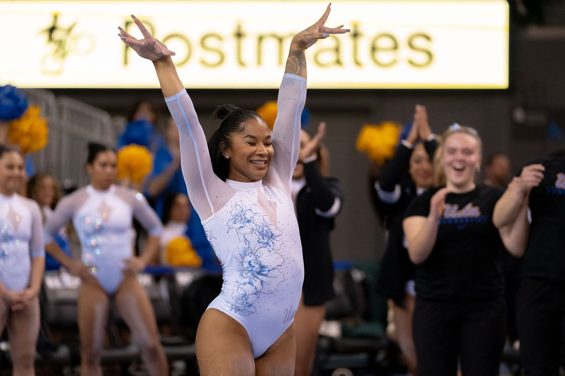 Chiles posing at the Michigan State v UCLA gymnastics meet - (Source: Getty)