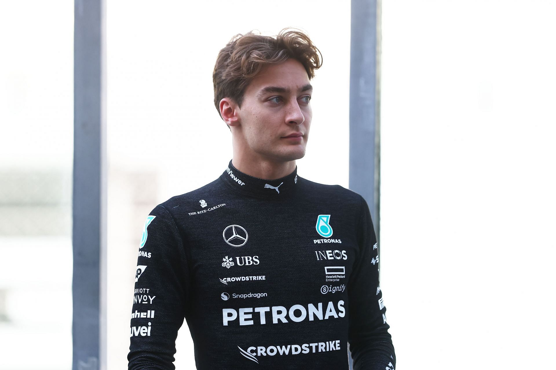 George Russell of Great Britain and Mercedes looks on in the Pitlane - Source: Getty