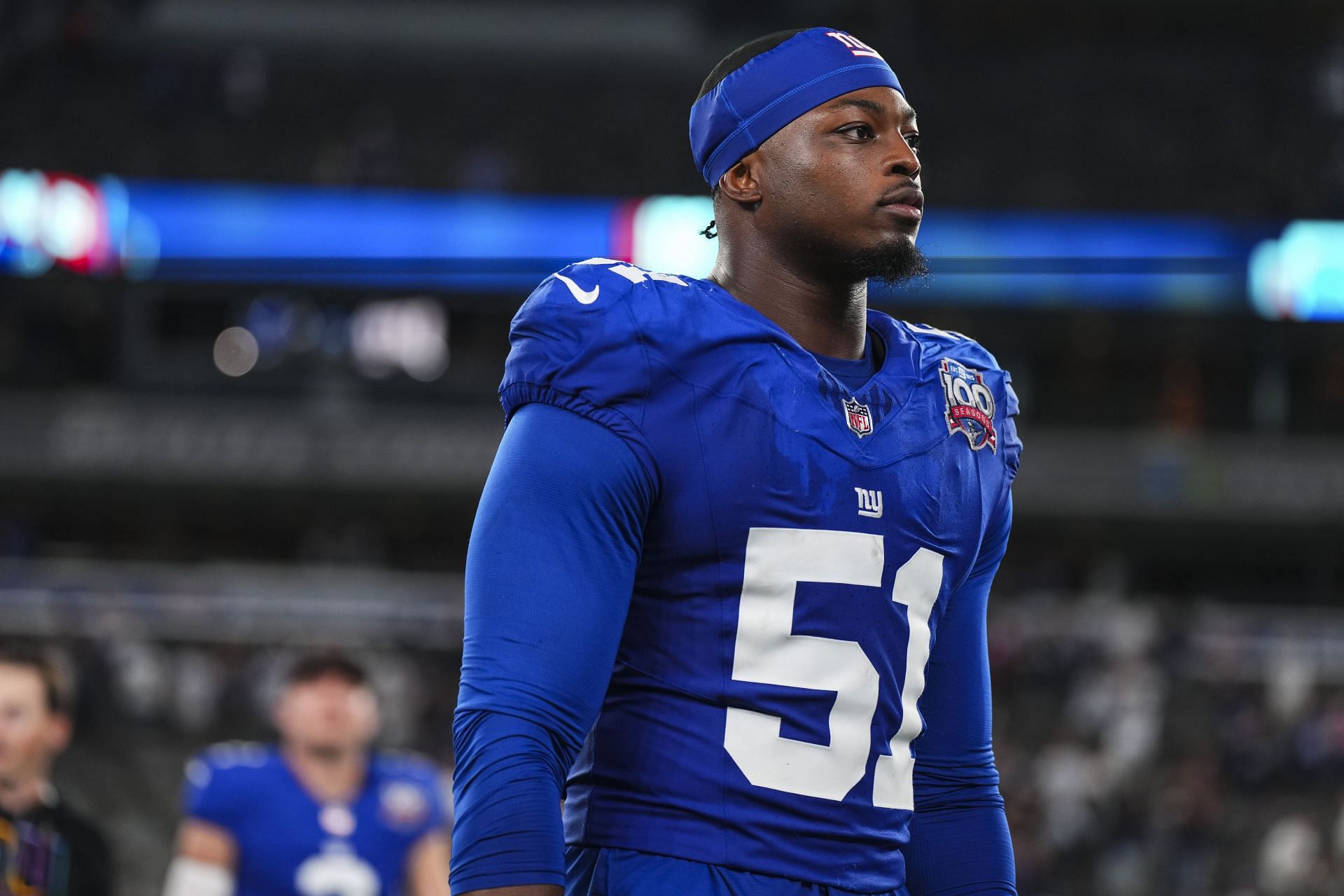 Azeez Ojulari of the New York Giants walks off of - Source: Getty