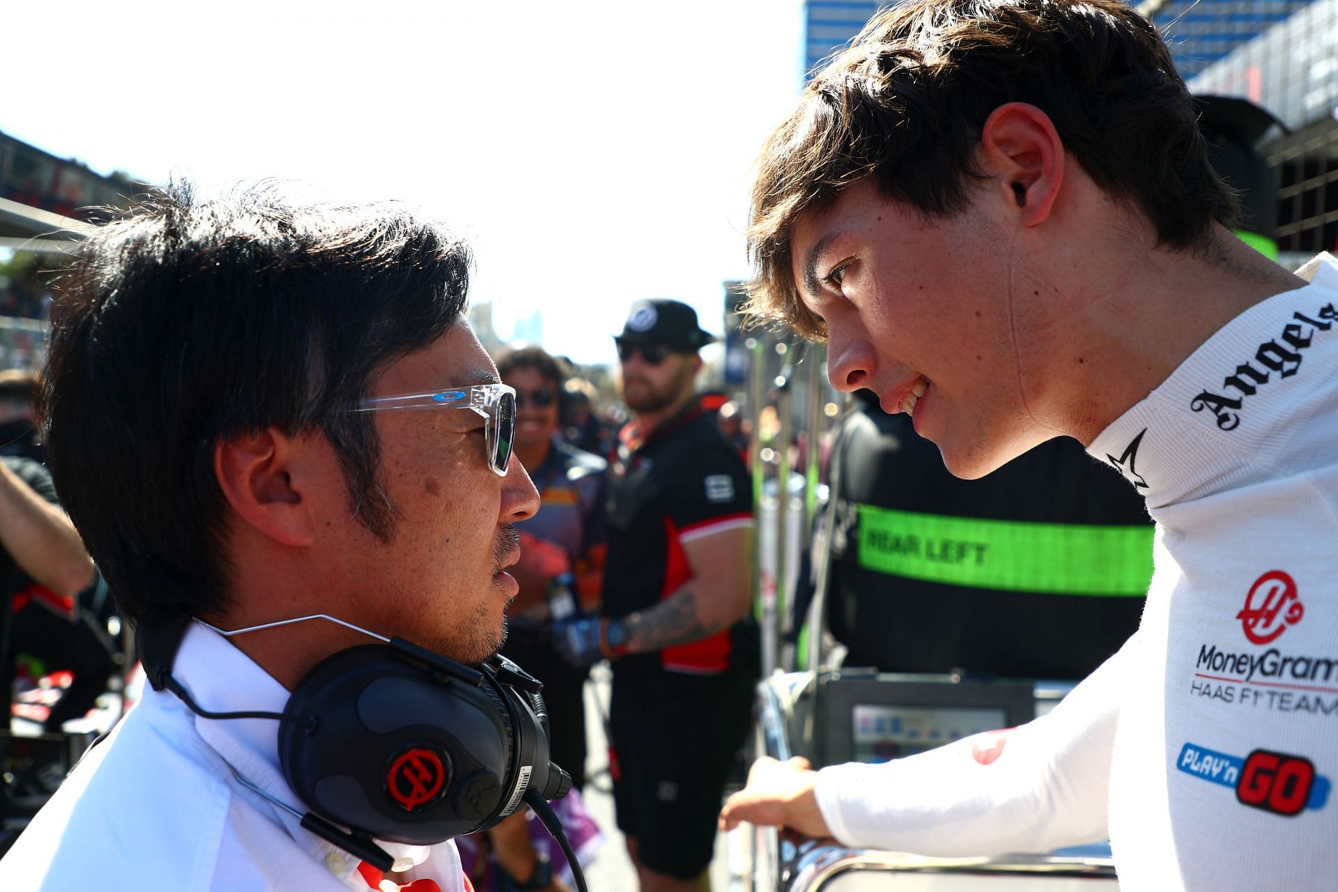 Haas tem principal Ayao Komatsu [L] with Oliver Bearman [R] (Image Source: Getty)