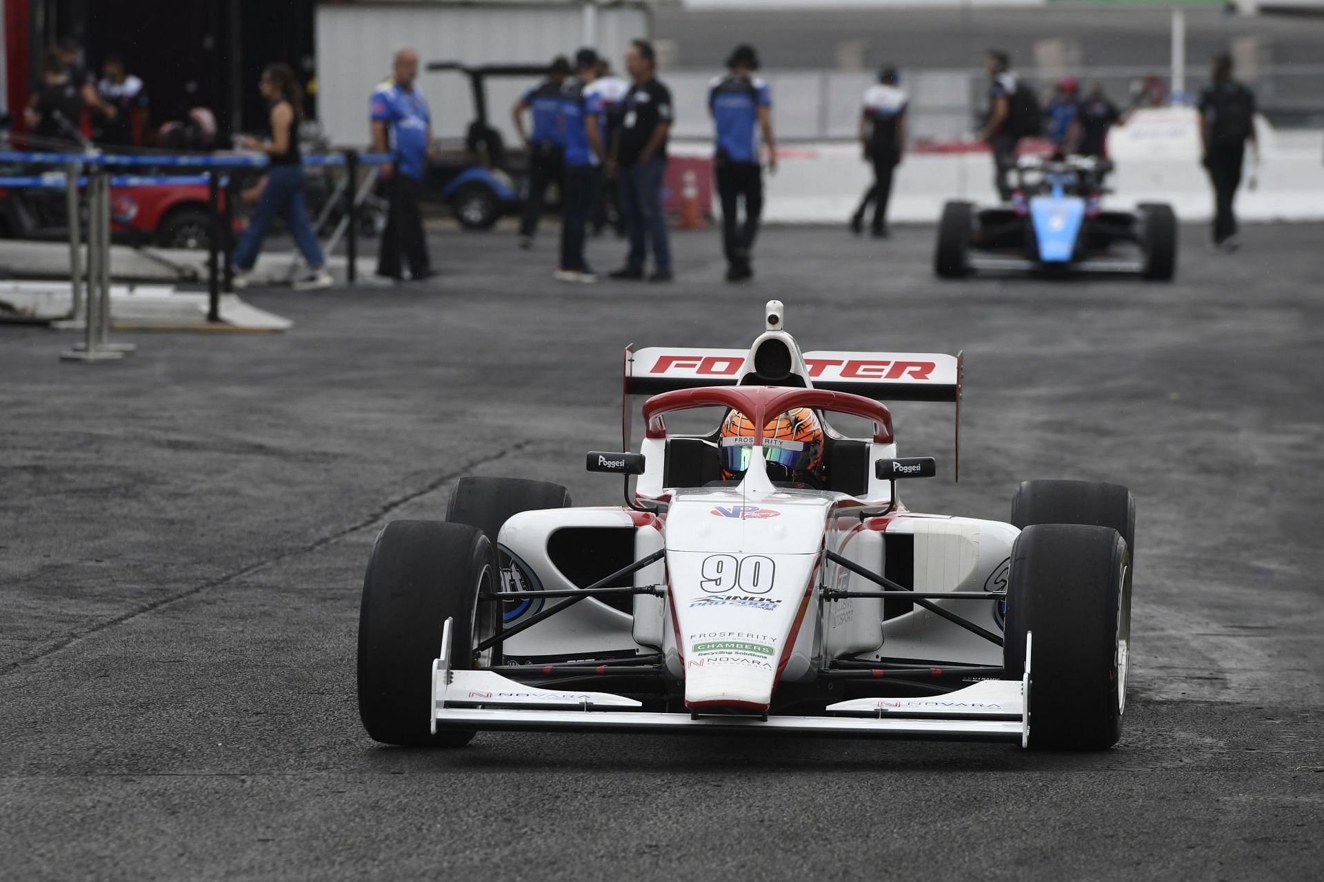 Foster (90) drives through the paddock during practice for the Indy Pro 2000 Series race - Source: Getty