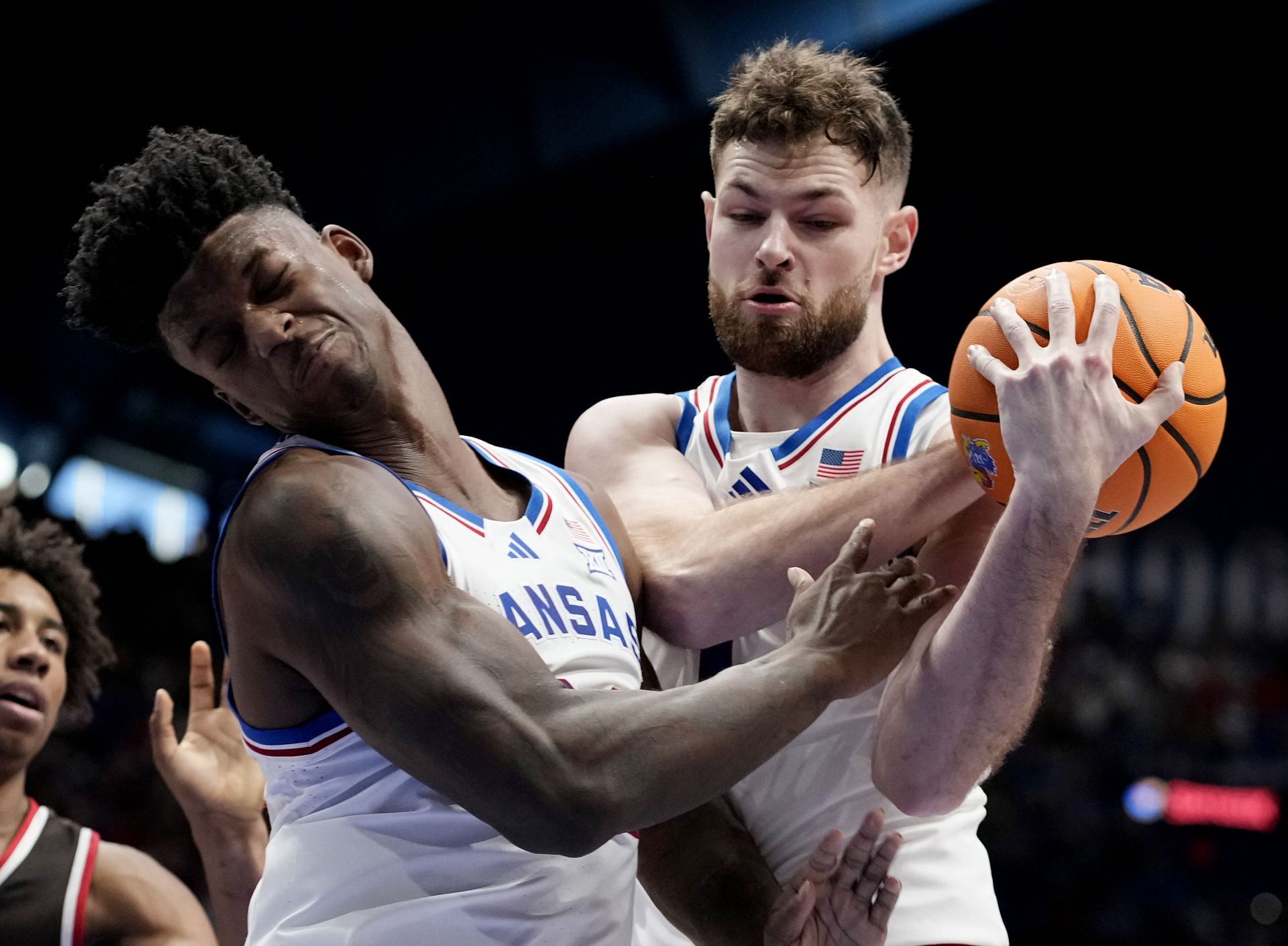 KJ Adams Jr. (#24) and Hunter Dickinson #1 of the Kansas Jayhawks battle for the ball against the Brown Bears in the second half of their NCAA game at Allen Fieldhouse on December 22, 2024 in Lawrence, Kansas. Photo: Getty