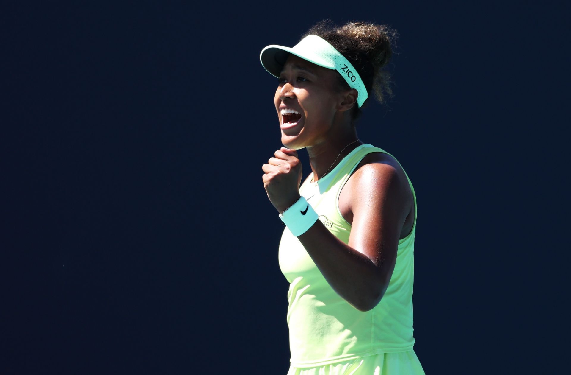 Naomi Osaka of Japan celebrates winning the second set against Yuliia Starodubtseva of the Ukraine during their match on Day 1 of the Miami Open - Source: Getty