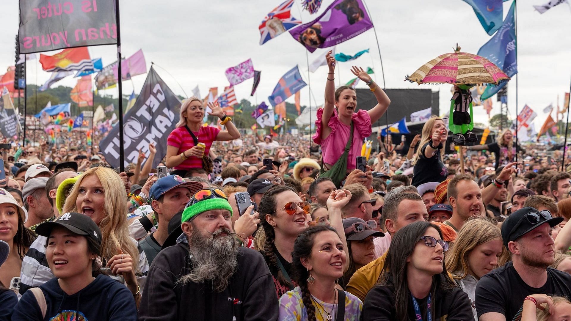 Music fans cheer as they watch a performance on the Other Stage during day five of Glastonbury Festival 2024 at Worthy Farm, Pilton on June 30, 2024, in Glastonbury, England. (Image via Getty/Matt Cardy)