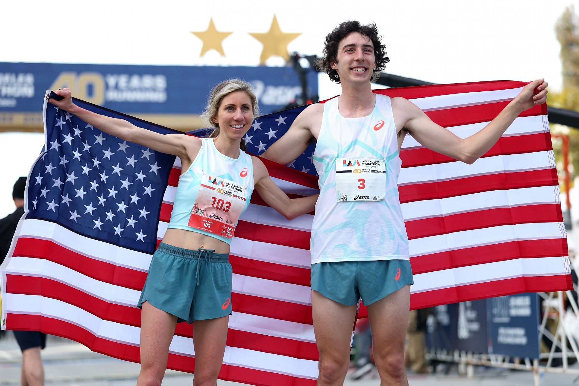 Rachtman celebrates with the female winner of Los Angeles Marathon 2025 Savannah Berry (Image via: Getty Images)