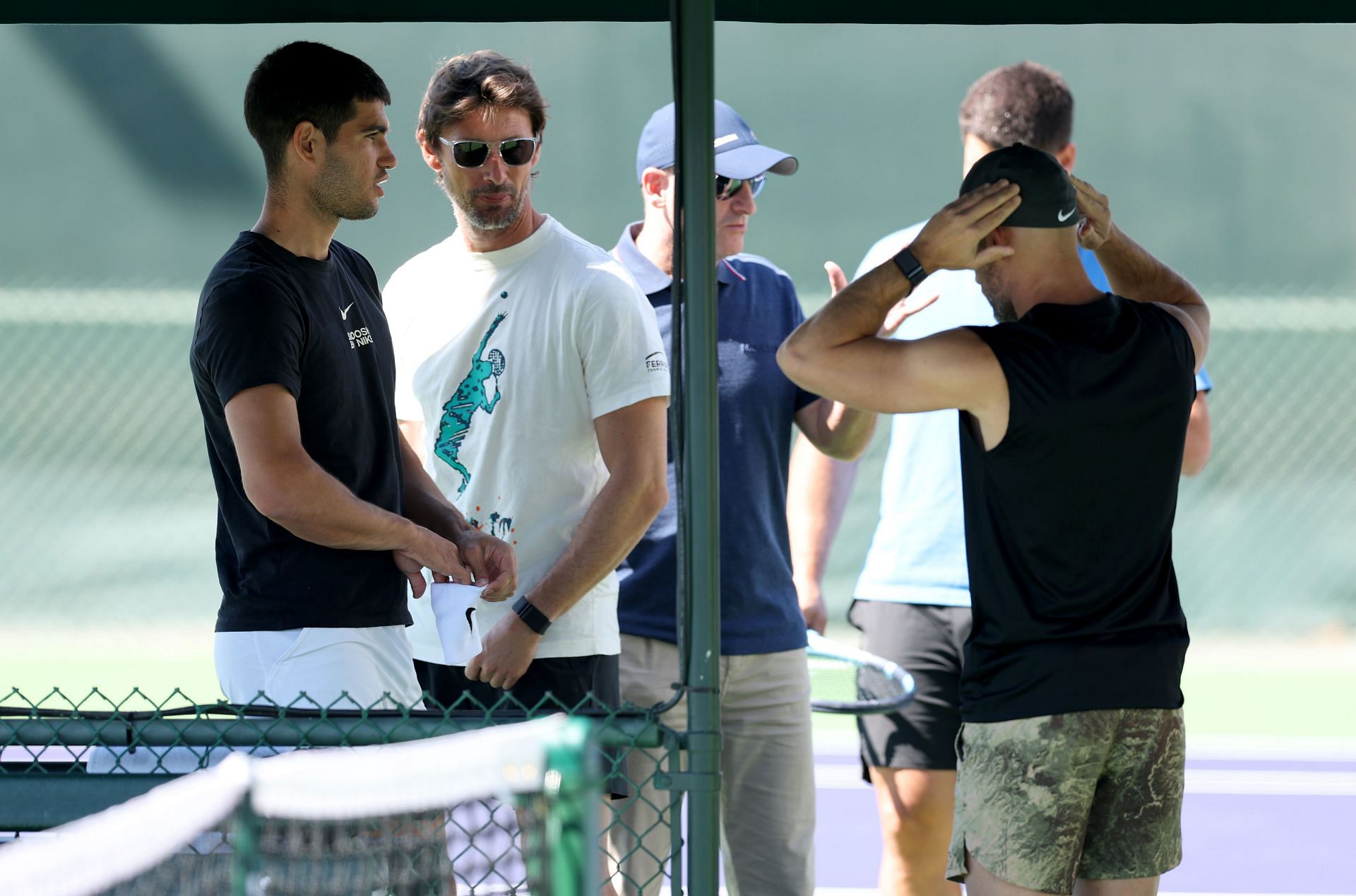 Carlos Alcaraz pictured with coach Juan Carlos Ferrero at his pre-match practice - Image Source: Getty