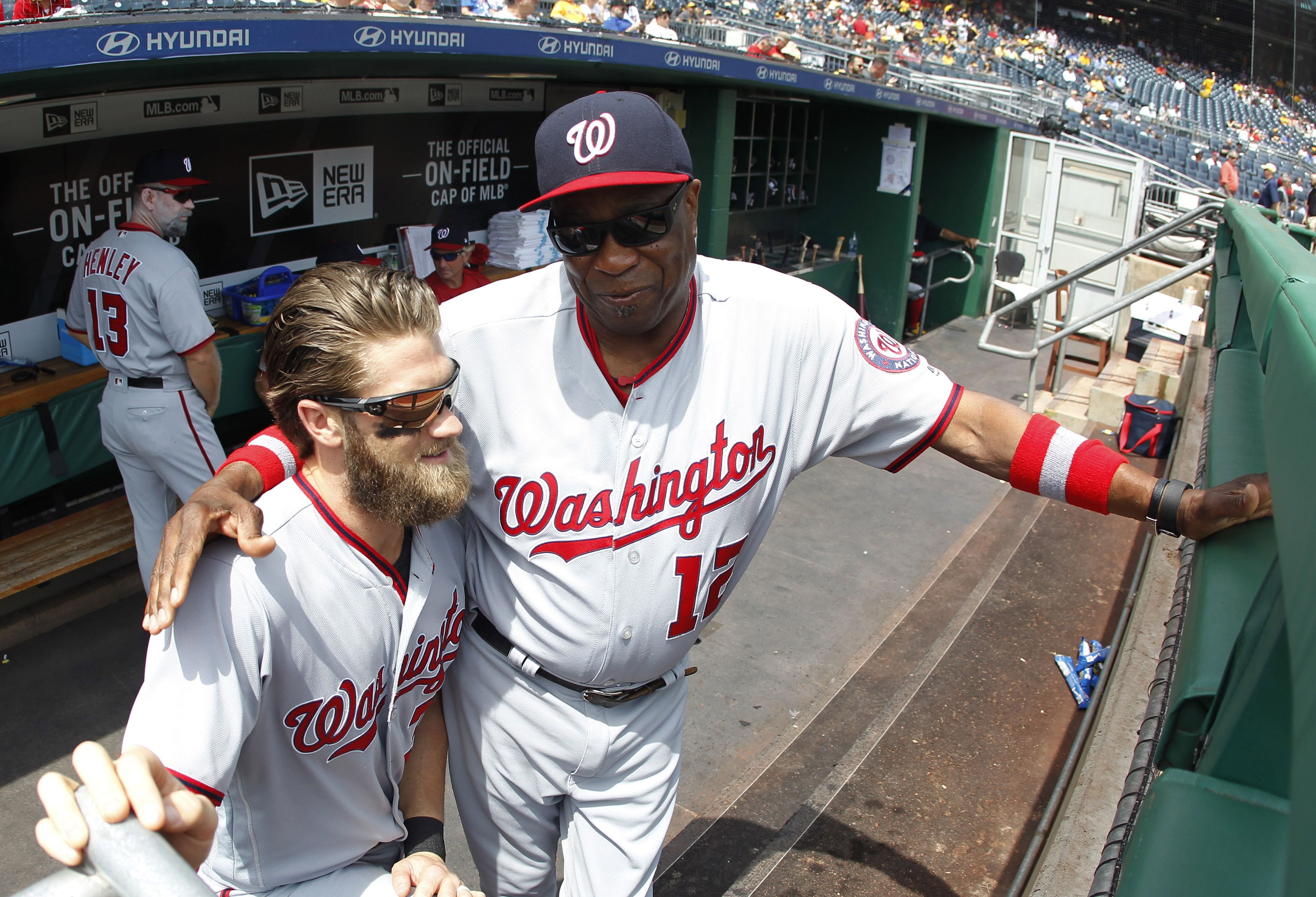 Former Washington Nationals star Bryce Harper, left, and manager Dusty Baker (Photo via IMAGN)