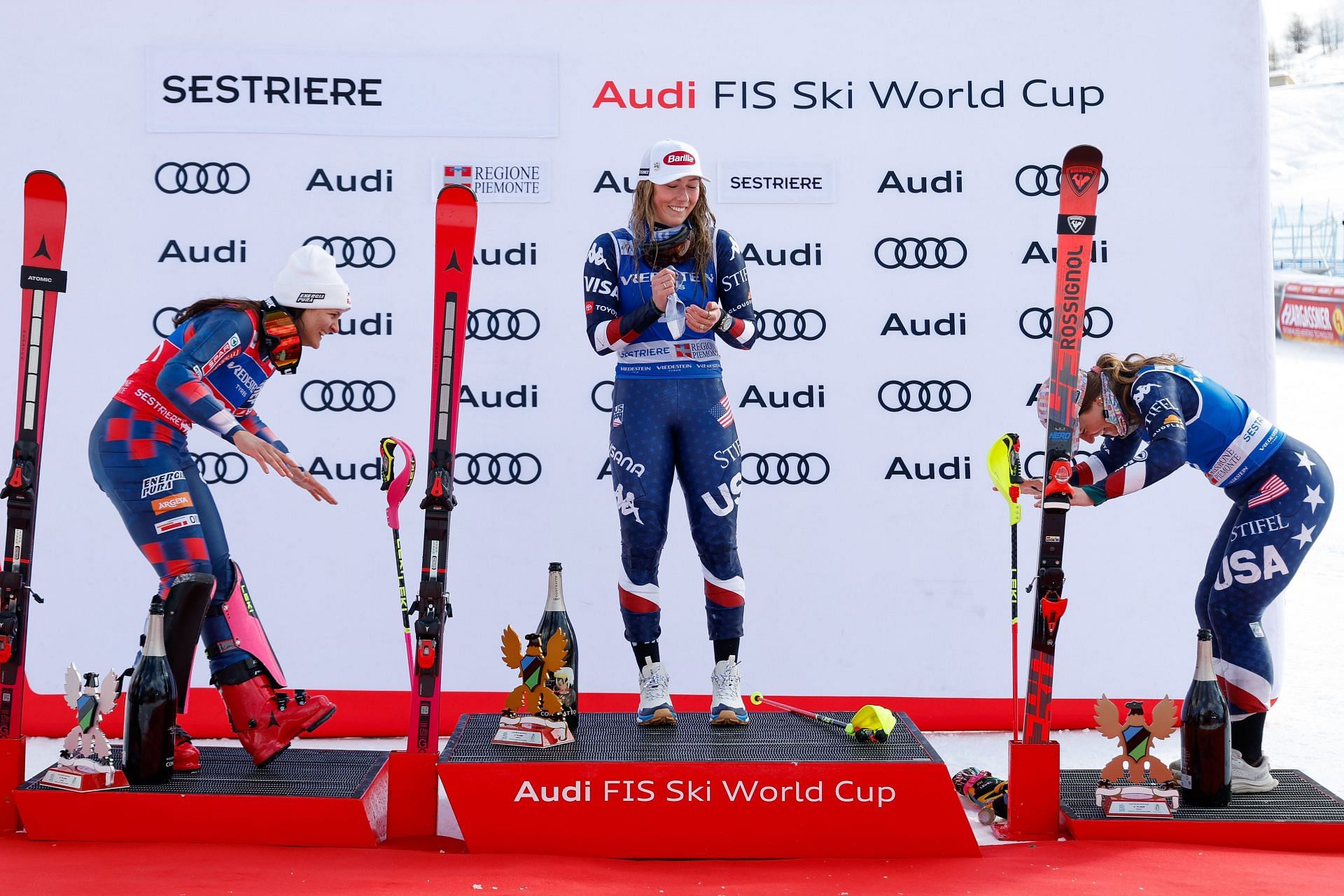 Shiffrin (middle) getting appreciated by fellow skiers after clinching her 100th World Cup win (Image via: Getty Images)