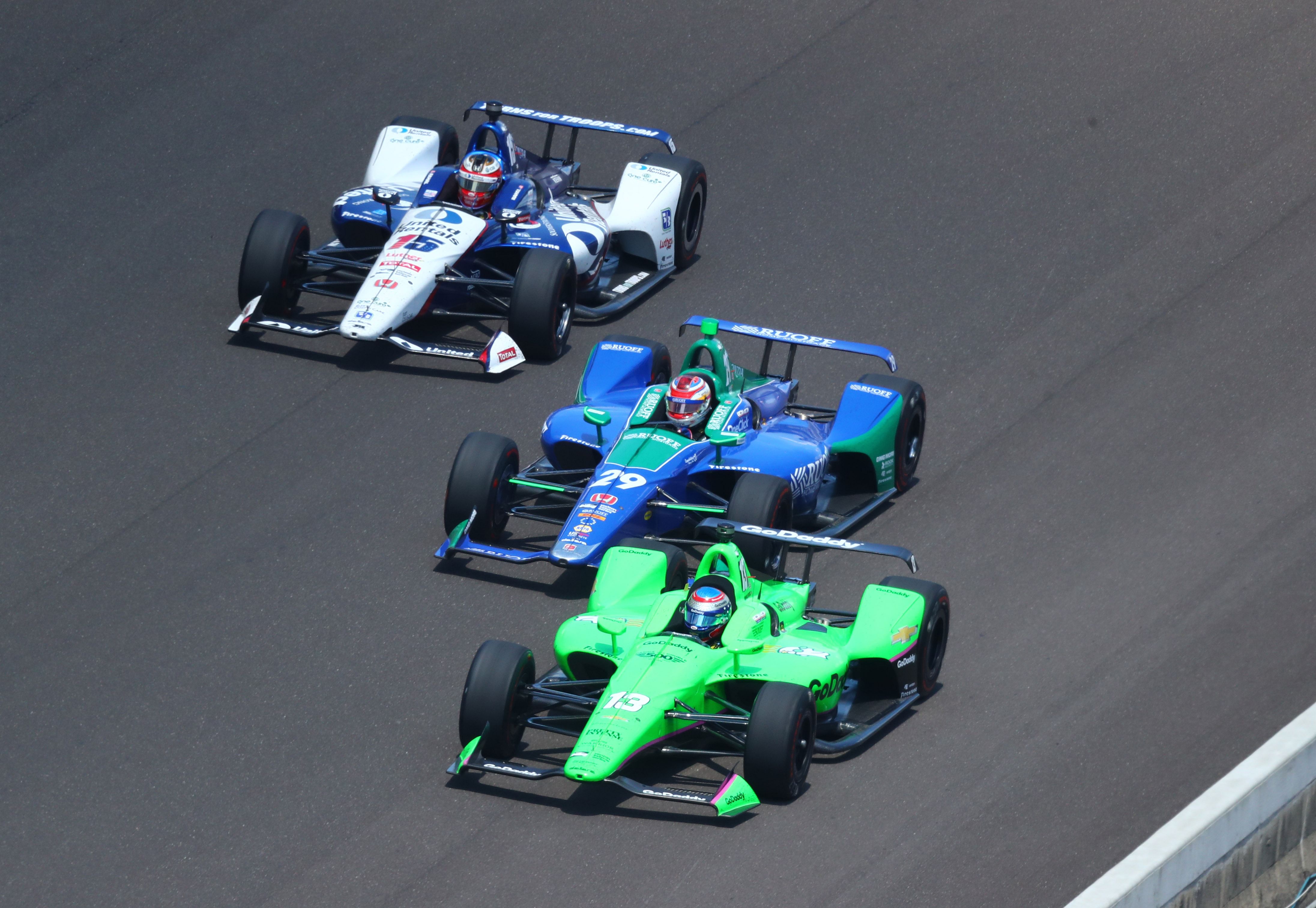 Danica Patrick (right) races alongside Carlos Munoz (center) and Graham Rahal during the 2018 Indianapolis 500- Source: Imagn