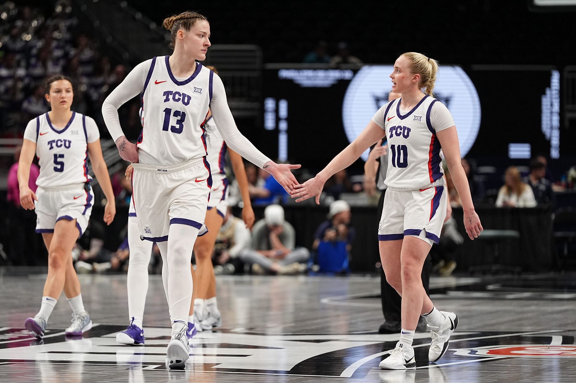 Hailey Van Lith (#10) of the TCU Horned Frogs and Sedona Prince (#13) of the TCU Horned Frogs celebrate in between plays against the Colorado Buffaloes during the fourth quarter in the quarterfinal round of the womens Big 12 Championship at T-Mobile Center on March 7, 2025. Photo: Getty