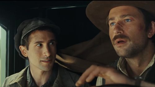 Brandon Sklenar as Spencer Dutton, alongside his companion Luca, played by Joseph Mawle, in a tense discussion while traveling across the American frontier in 1923 season 2. (Image via Paramount+)