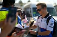 Liam Lawson of Visa Cash App RB greets fans as he arrives in the Paddock prior to the F1 Grand Prix of Abu Dhabi at Yas Marina Circuit on December 08, 2024 - Source: Getty