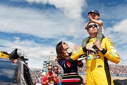 Samantha Busch dazzles in 'loud sparkly' race day fit featuring shimmer pants to support husband Kyle Busch at the Pennzoil 400