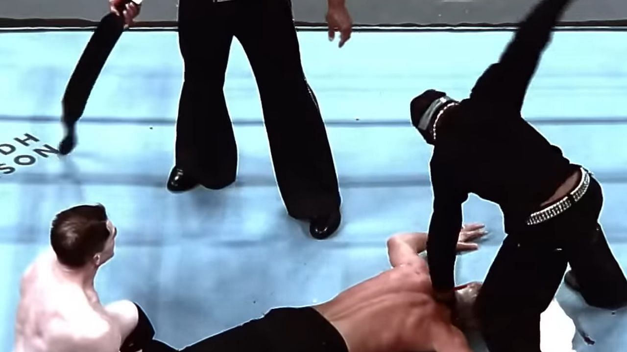 Scott slapping Rhodes (via WWE
