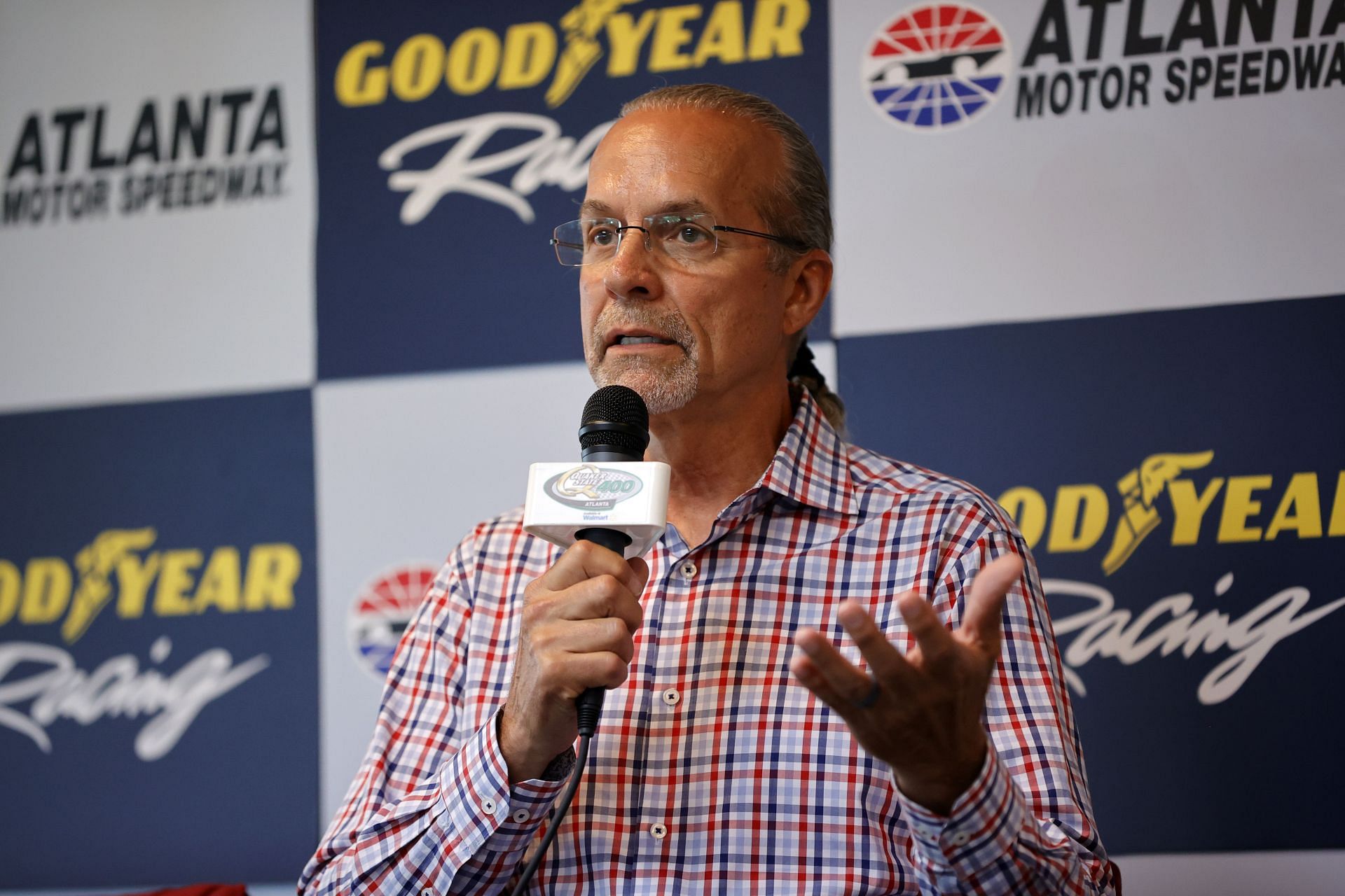 HAMPTON, GEORGIA - JULY 09: NASCAR commentator, Kyle Petty, (L) speaks to the media during a press conference for Goodyear