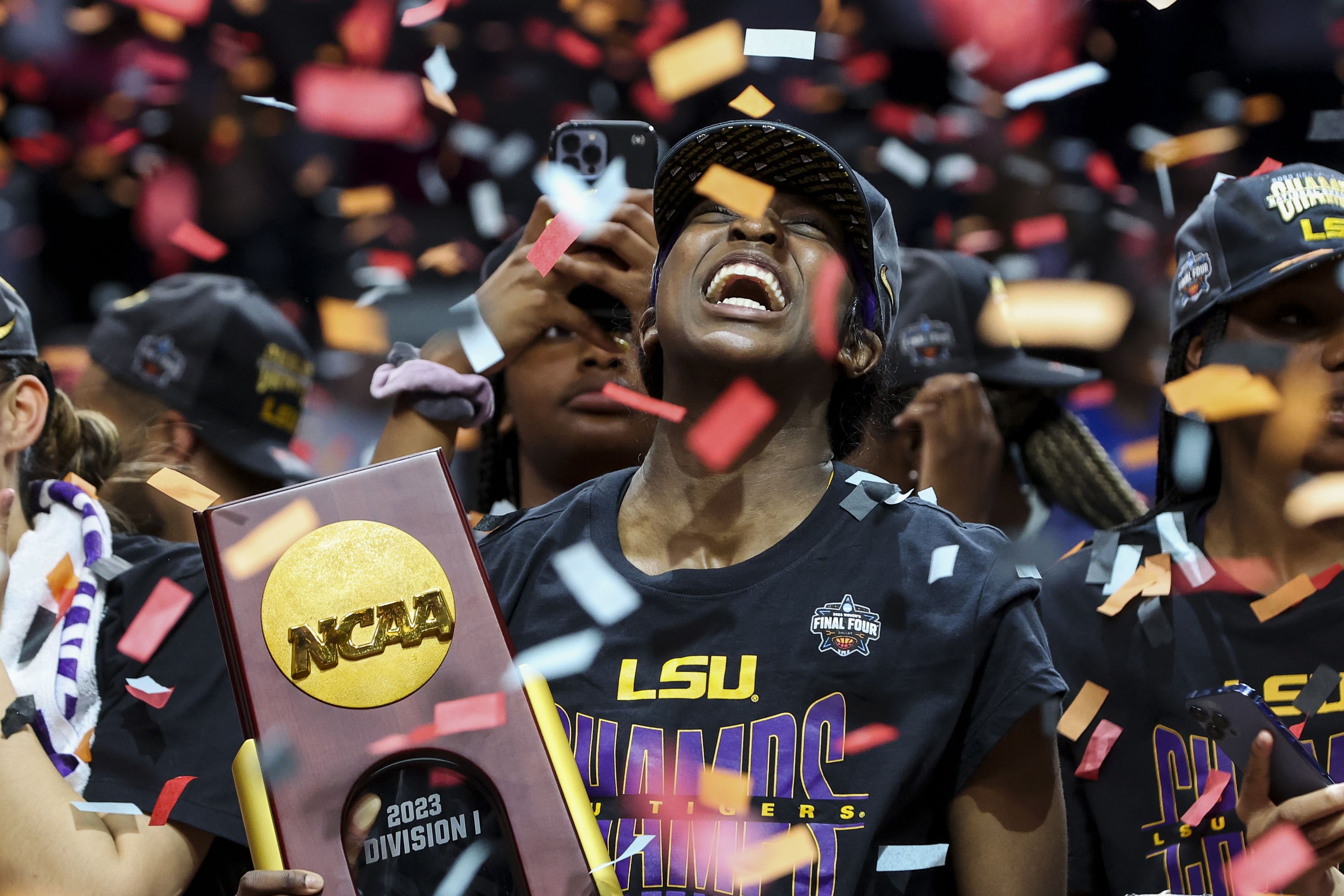 LSU Tigers guard Flau&#039;jae Johnson (#4) celebrates with the tournament trophy after defeating the Iowa Hawkeyes in the 2023 NCAA national championship game. Photo: Imagn