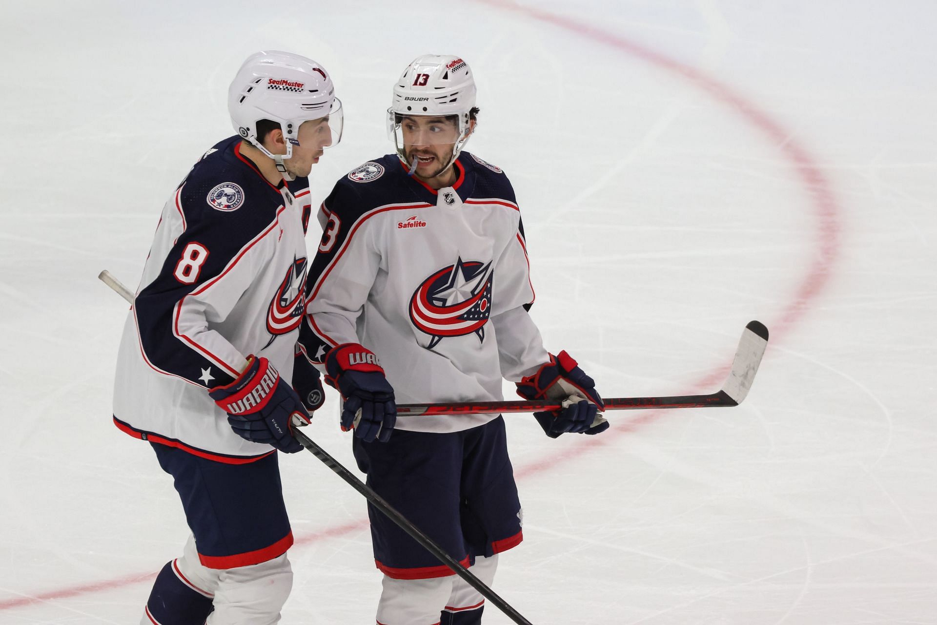 Columbus Blue Jackets defenseman Zach Werenski (8) and Columbus Blue Jackets forward Johnny Gaudreau (13) talk during an NHL regular season hockey game between the Columbus Blue Jackets and the Detroit Red Wings on March 19, 2024 - Source: Getty