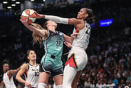 Las Vegas Aces forward A'ja Wilson (#22) blocks a shot taken by New York Liberty guard Sabrina Ionescu (#20) in the first quarter at Barclays Center. Photo: Imagn