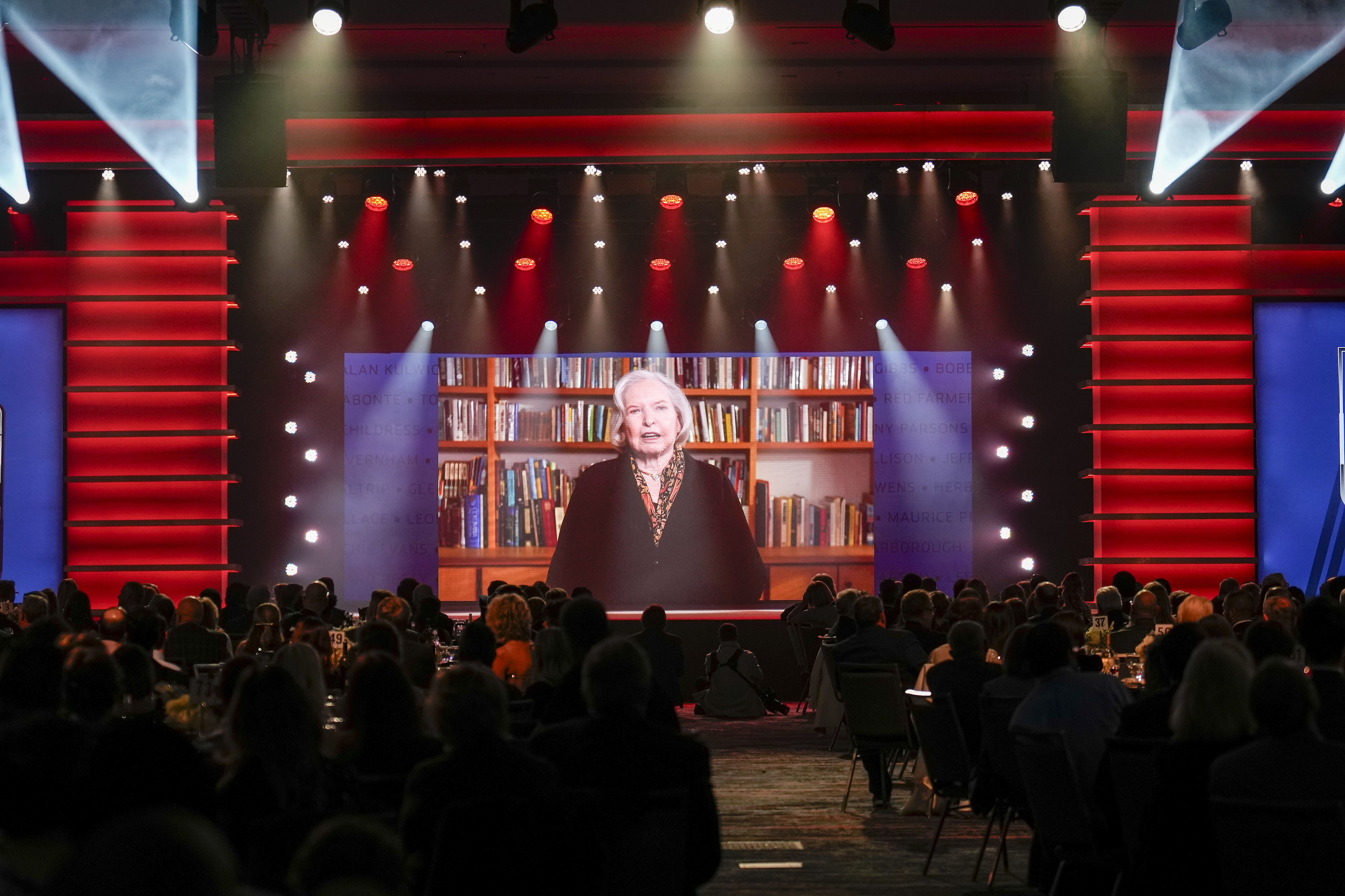 Janet Guthrie speaking at the NASCAR Hall of Fame Induction Ceremony - Source: Imagn