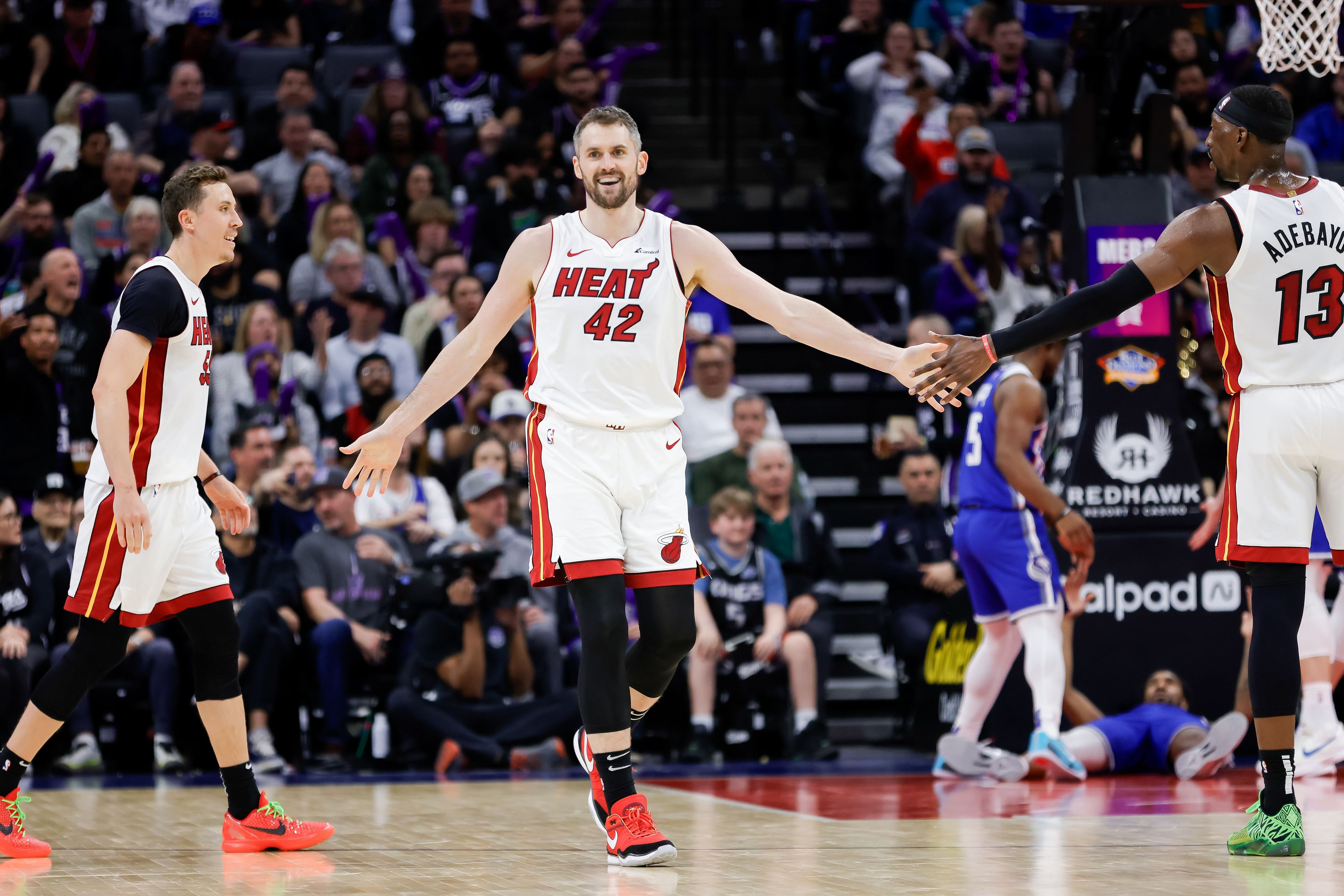 Miami Heat forward Kevin Love celebrates with center Bam Adebayo against the Sacramento Kings at Golden 1 Center. Photo Credit: Imagn