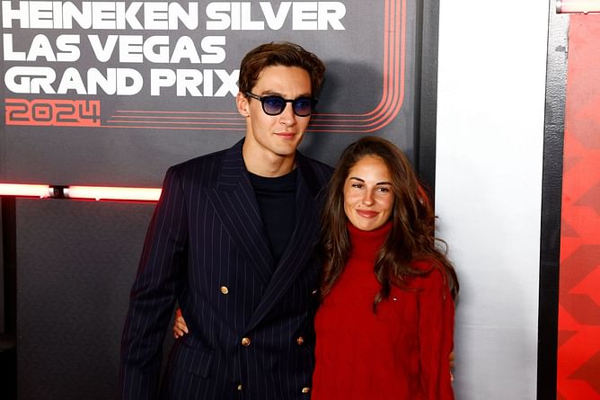 George Russell’s girlfriend Carmen Mundt makes a fashion statement with Red gown and beige trench coat
