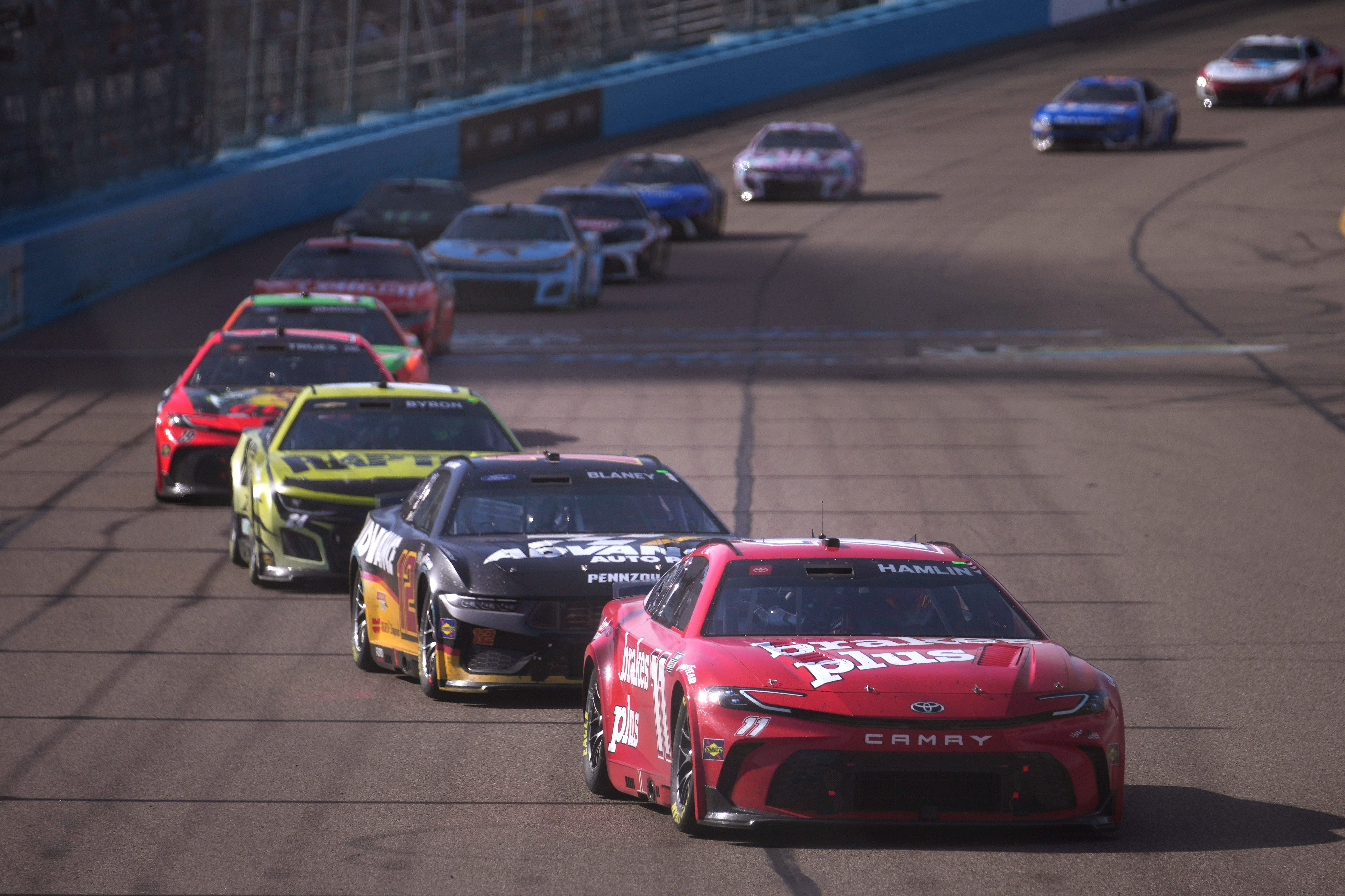 Denny Hamlin leads the pack at the NASCAR&#039;s Shriners Children&#039;s 500 - Source: Imagn