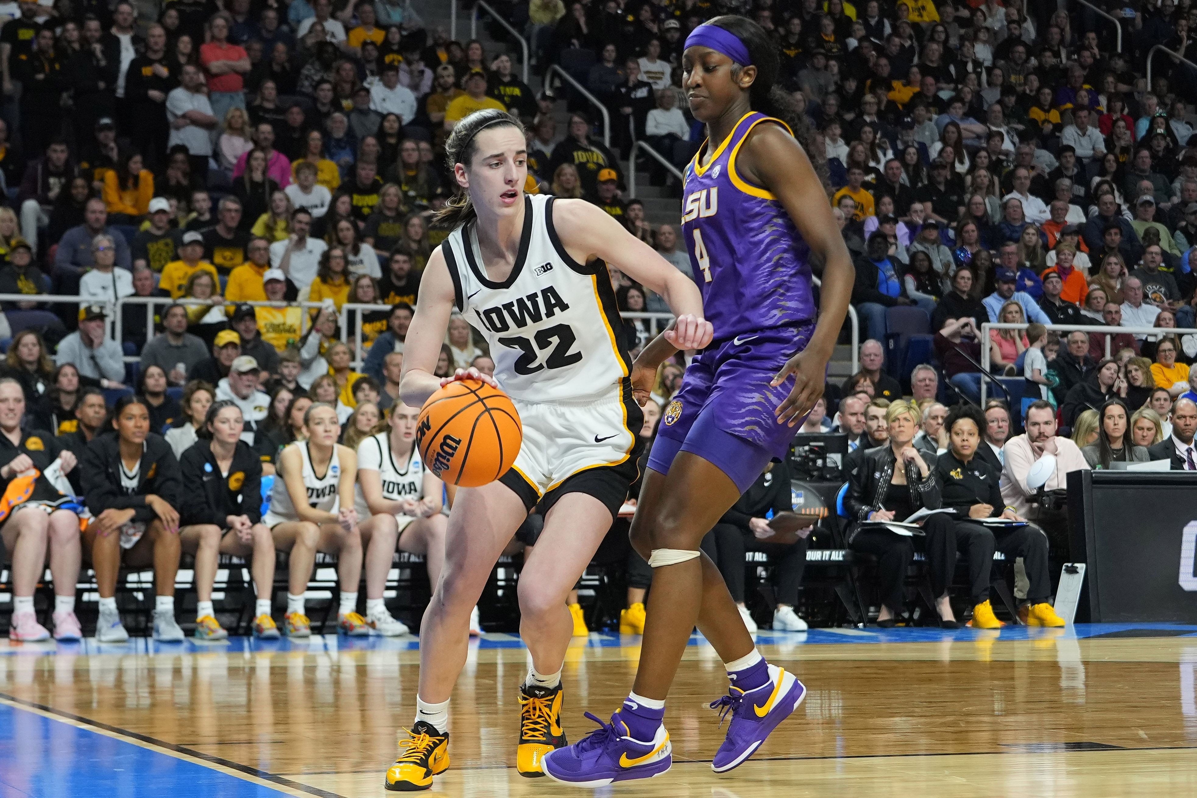 Iowa guard Caitlin Clark (22) controls the ball against LSU guard Flau&#039;jae Johnson (4) in the 2024 NCAA Tournament at MVP Arena. (Source: Imagn)