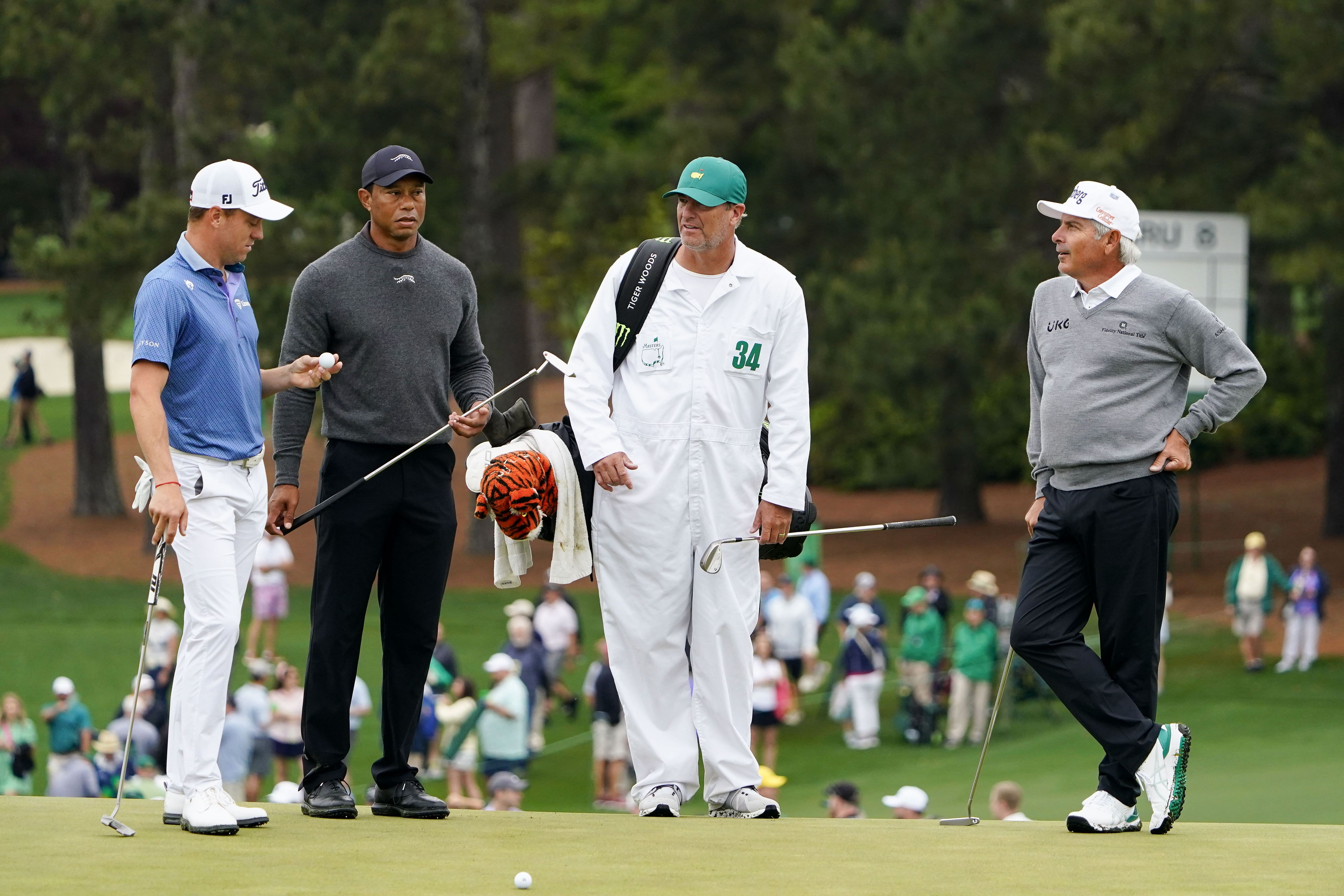 Justin Thomas, Tiger Woods, Lance Bennett, and Fred Couples stand on the no. 9 green during a practice round for the Masters Tournament 2024 - Source: Imagn
